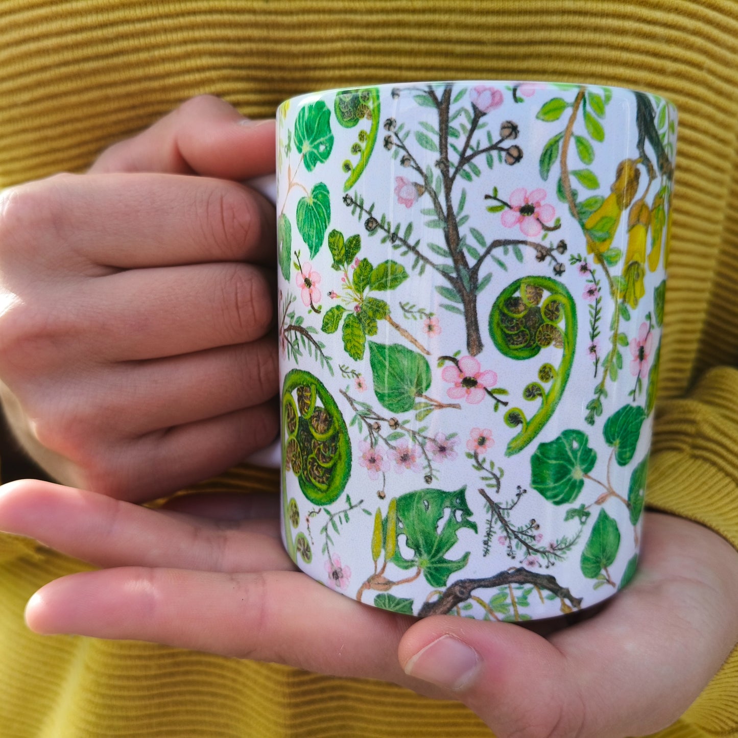 Milly’s hand-drawn NZ Flora design on ceramic mug from The Stripey Caterpillar