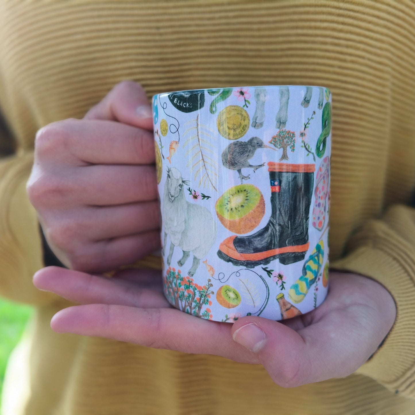 Milly’s hand-drawn kiwiana design on ceramic mug from The Stripey Caterpillar