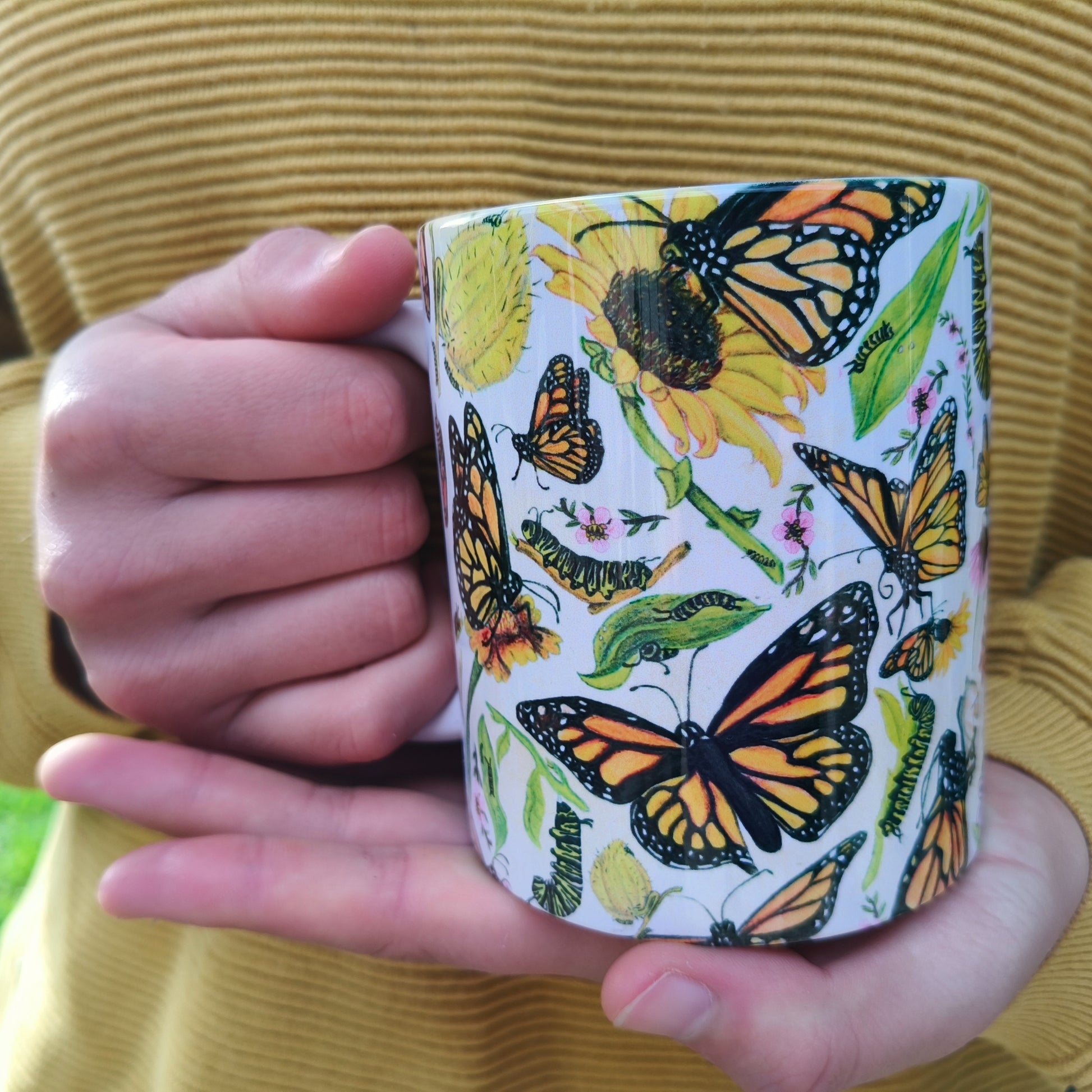 Milly’s hand-drawn butterfly design on ceramic mug from The Stripey Caterpillar
