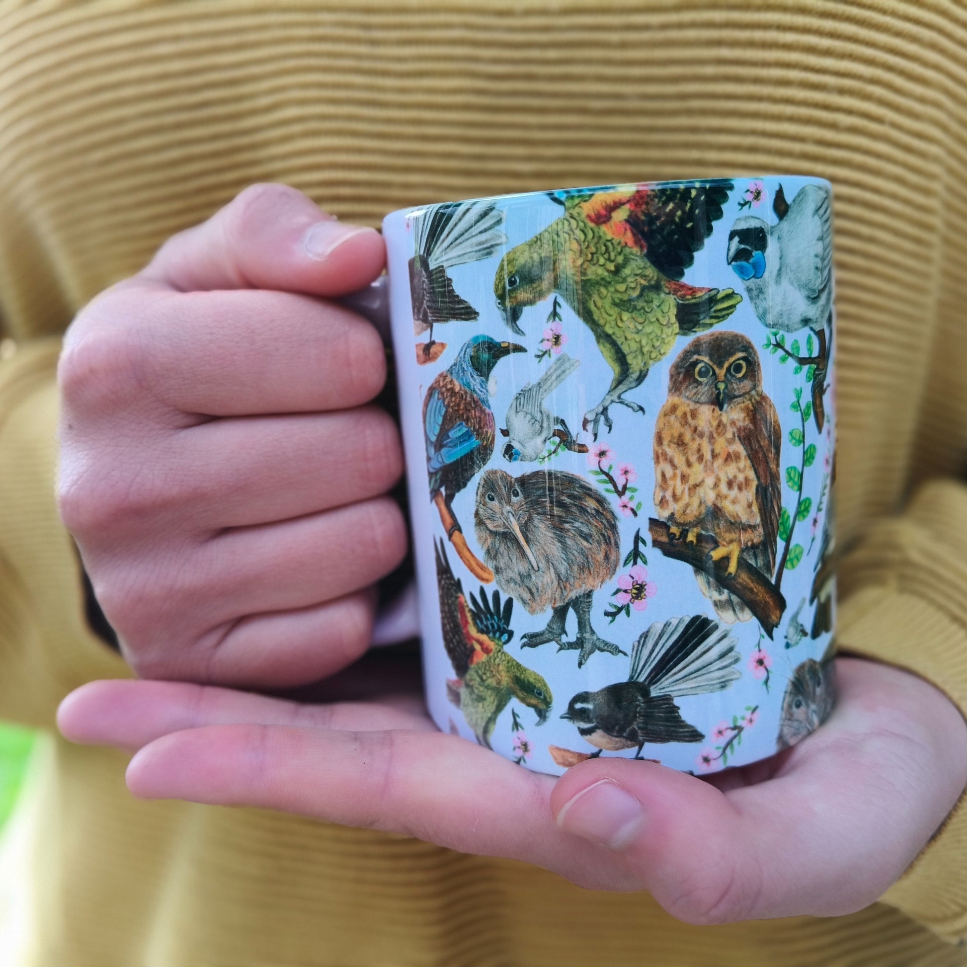 Milly’s hand-drawn NZ Birds design on ceramic mug from The Stripey Caterpillar