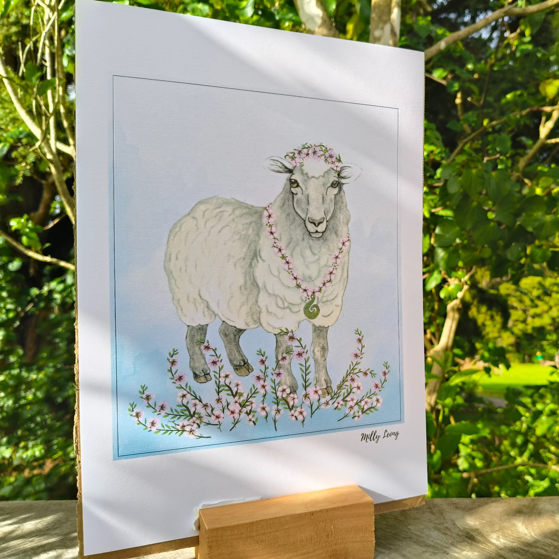 Illustration of a sheep with floral decorations on a white background, placed outdoors.