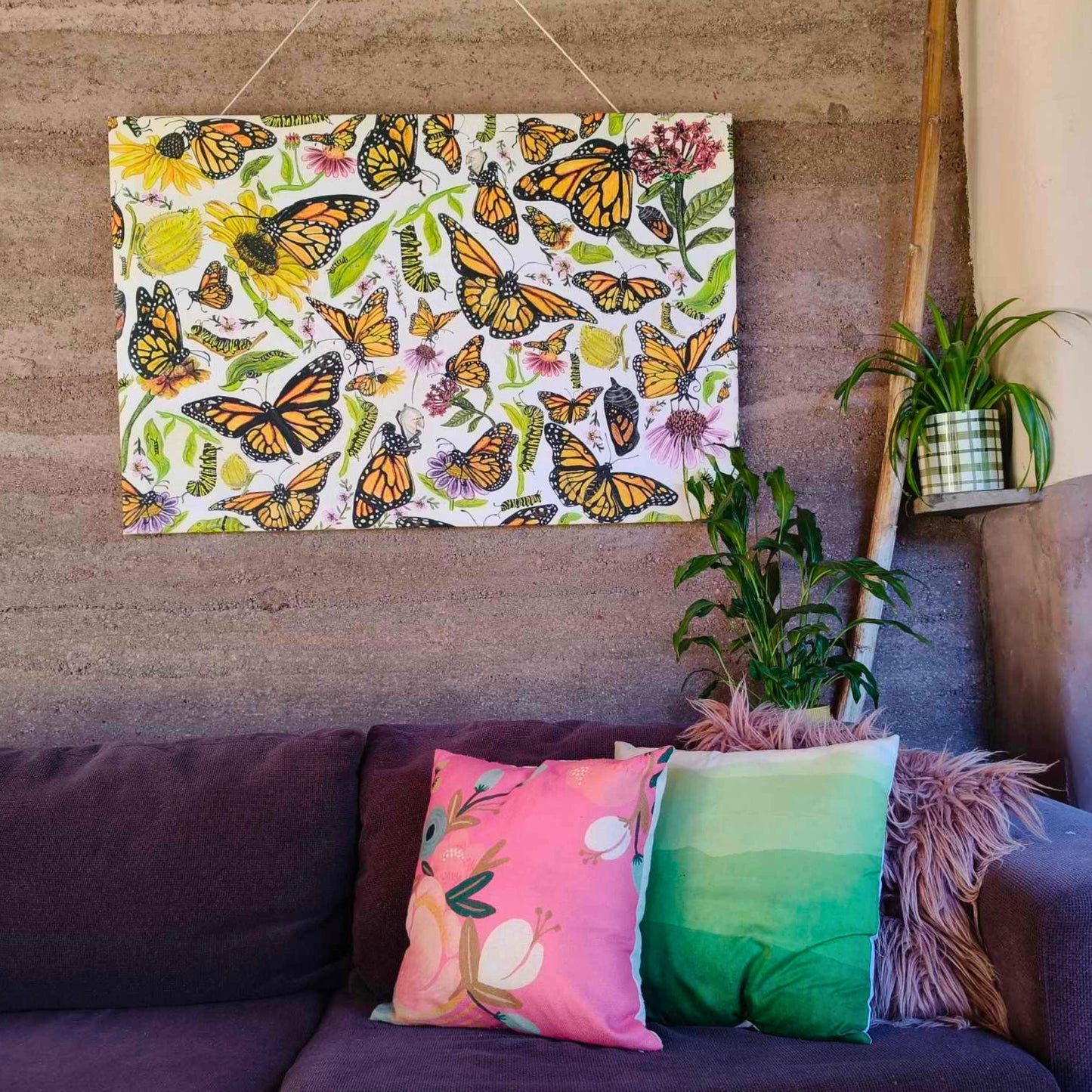 All the stages of a butterfly's lifecycle depicted on a large canvas by Milly.