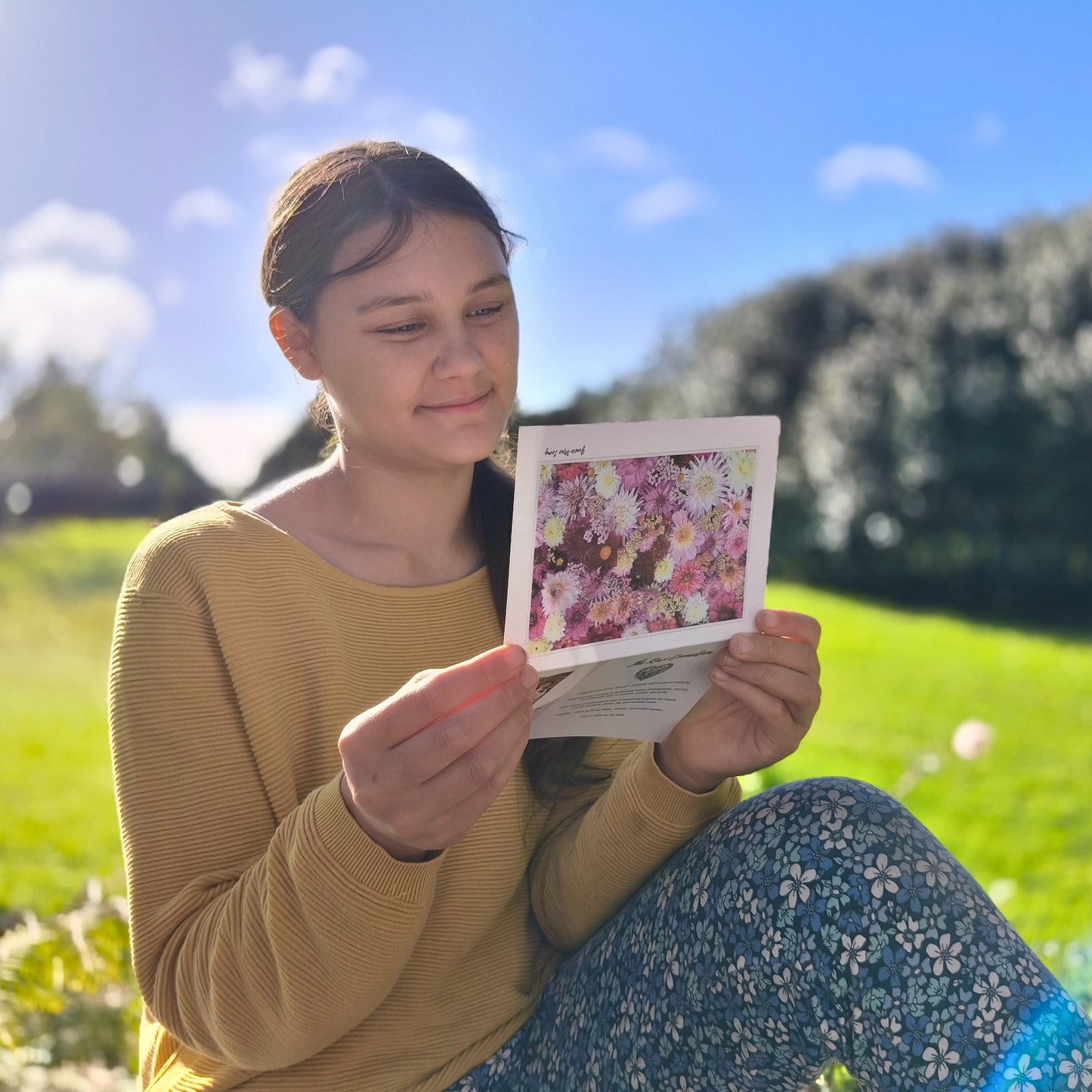 Greeting card featuring purple dahlia flatlay by Gracie-Mae – blank inside