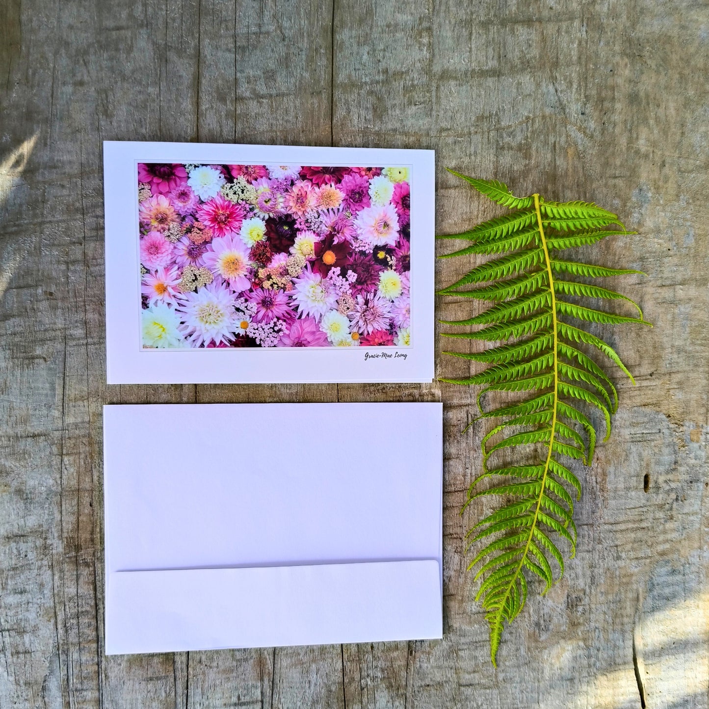 Greeting card featuring purple dahlia flatlay by Gracie-Mae – blank inside