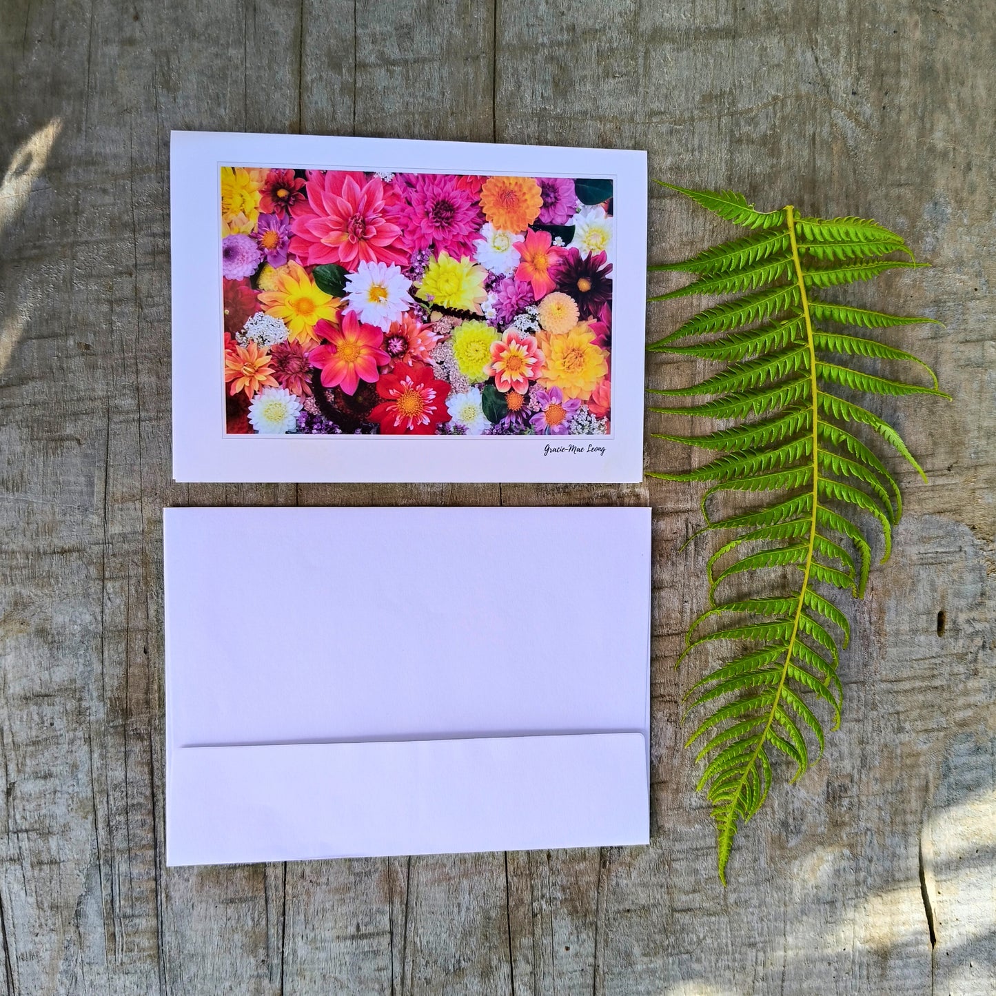 Greeting card featuring dazzling dahlia flatlay by Gracie-Mae – blank inside