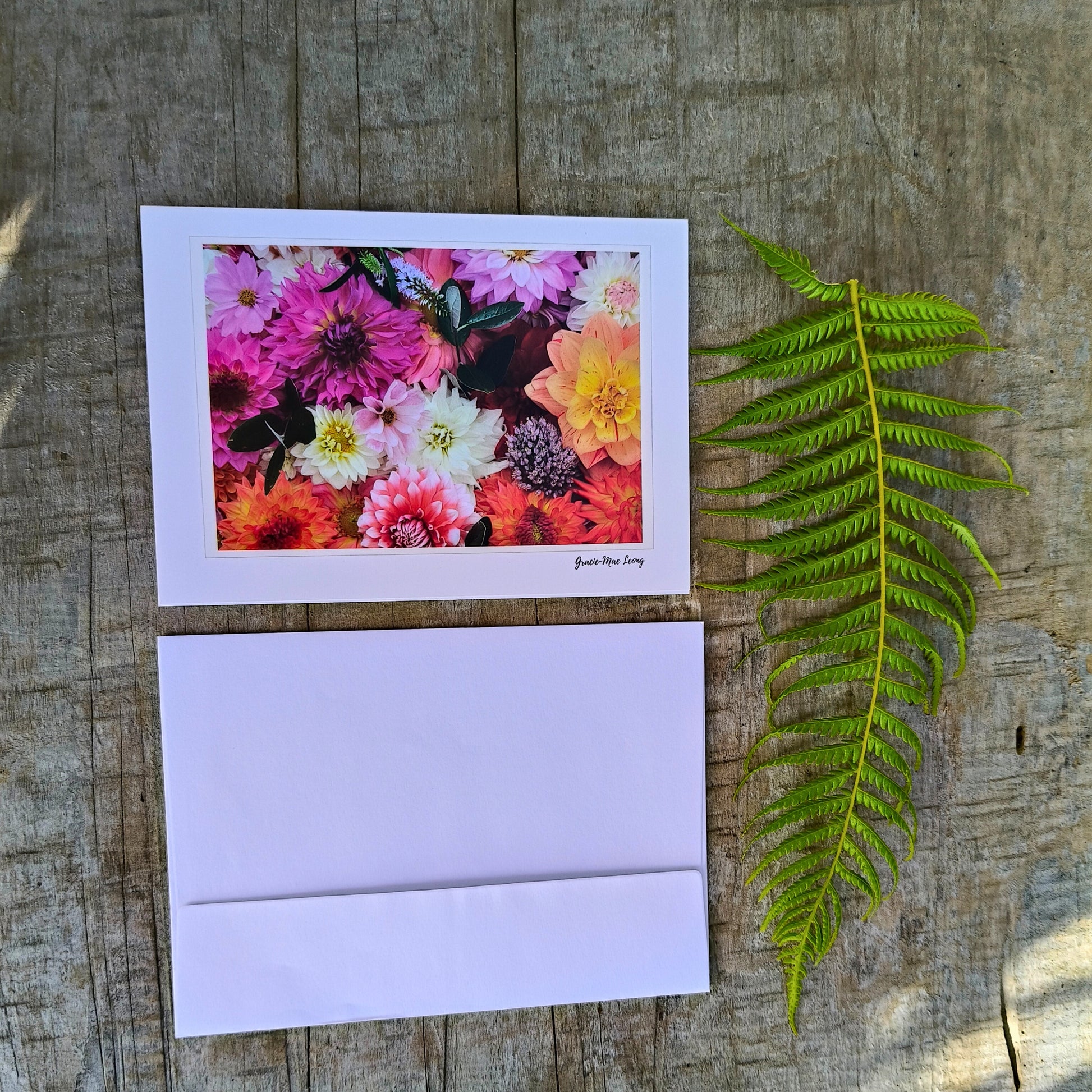 Greeting card featuring big pink dahlia flatlay by Gracie-Mae – blank inside