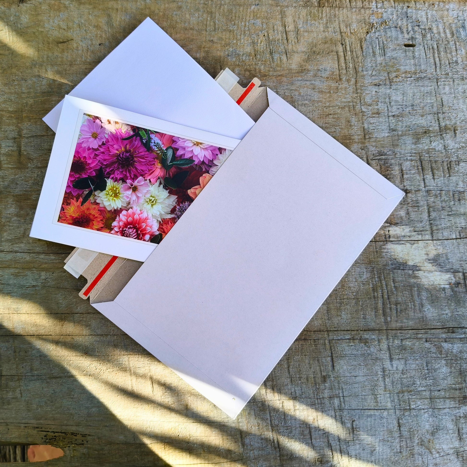 Greeting card featuring big pink dahlia flatlay by Gracie-Mae – blank inside