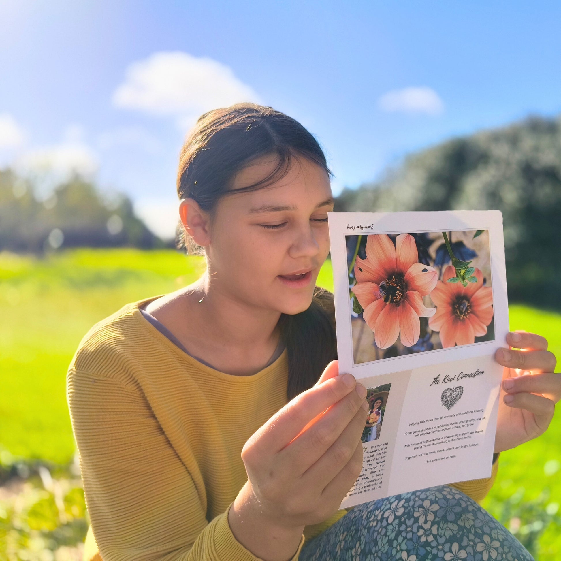 Greeting card featuring bumblebee on orange dahlia photography by Gracie-Mae – blank inside
