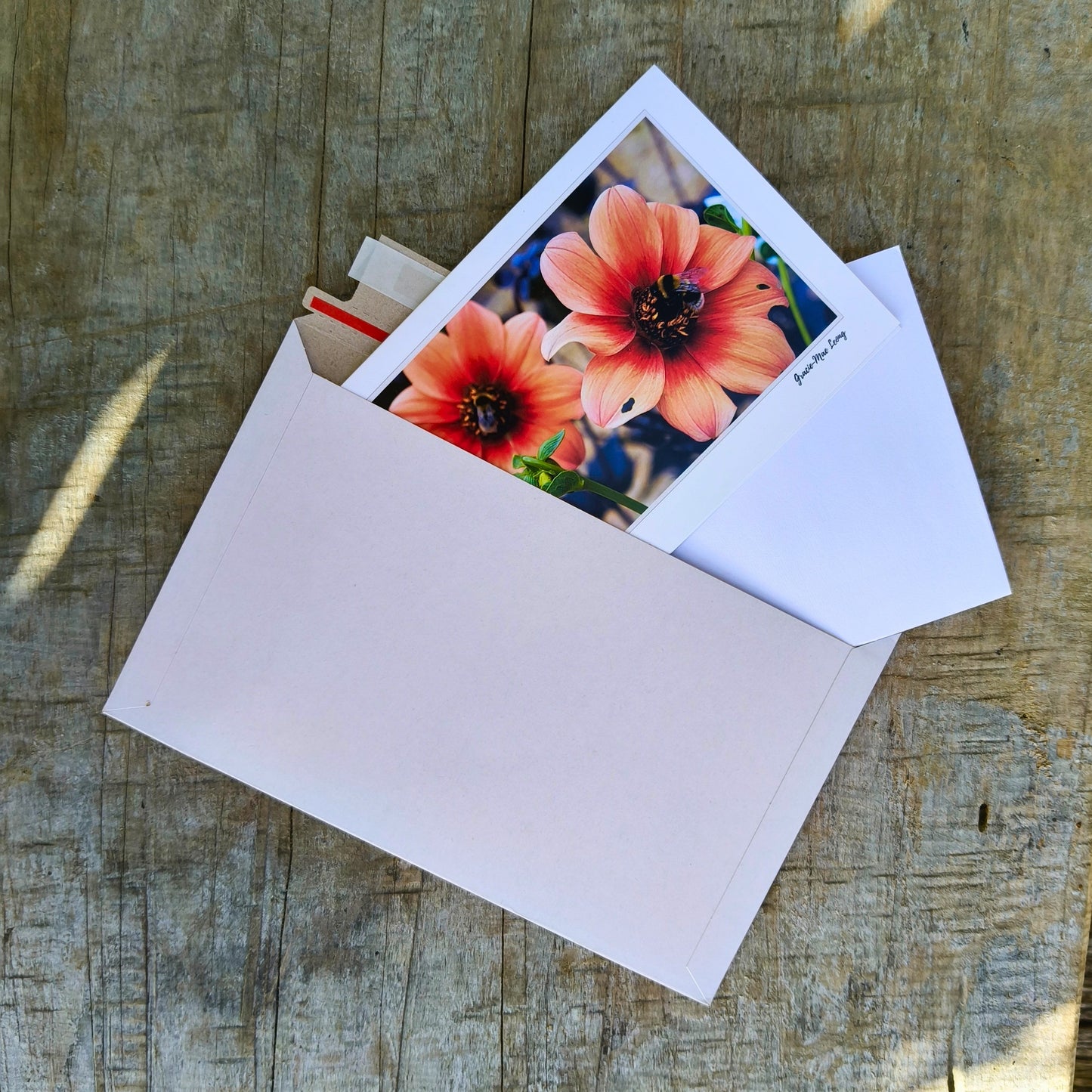 Greeting card featuring bumblebee on orange dahlia photography by Gracie-Mae – blank inside