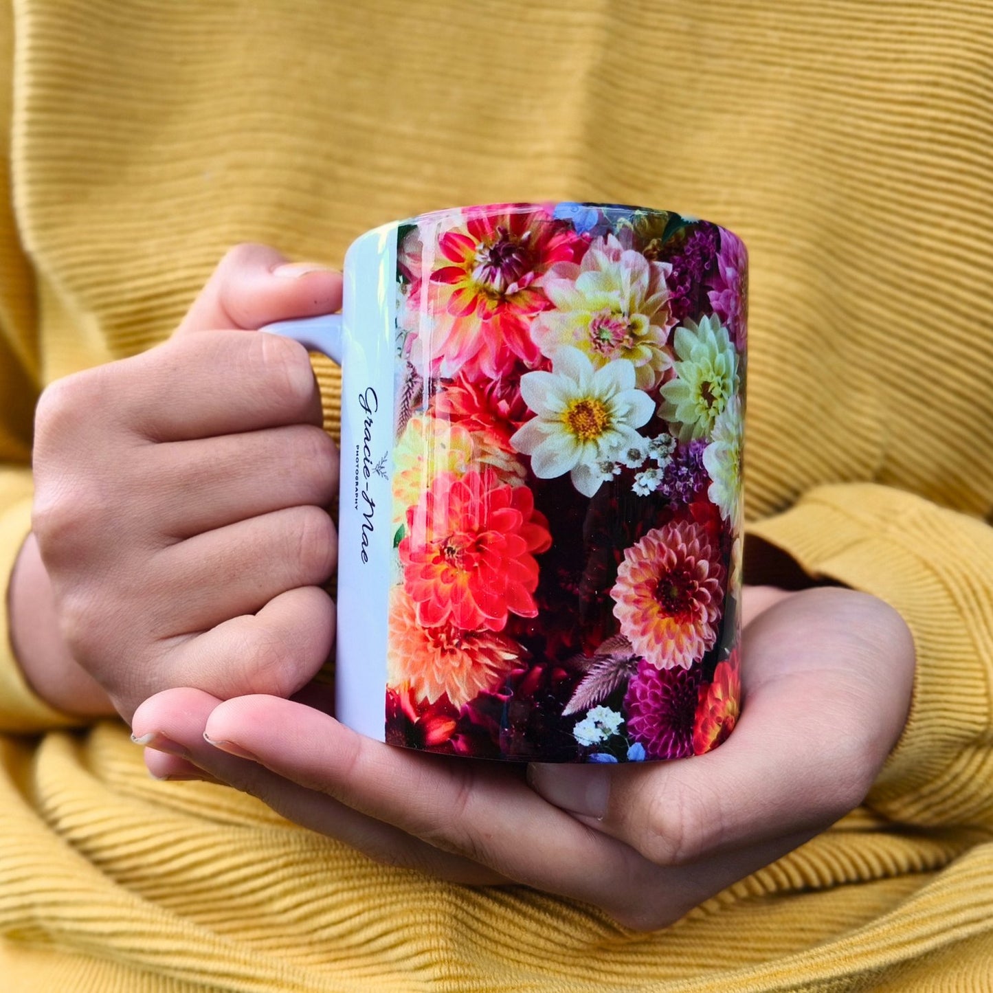 A colourful mug flly wrapped in unique dahlias of all kinds by Gracie-Mae Photography.